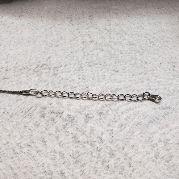 Beautiful silver tone small snake pattern necklace with a wing, a cross, bead - Picture 4 of 9